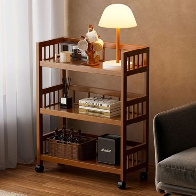 chariot de rangement utilise dans salon dessus livres veilleuse
