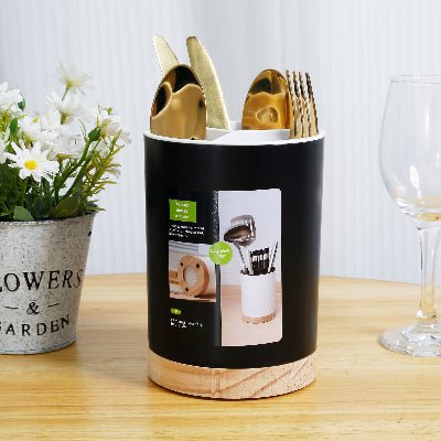 pot ustensiles cuisine preséntation noir avec couverts verre pot fleur