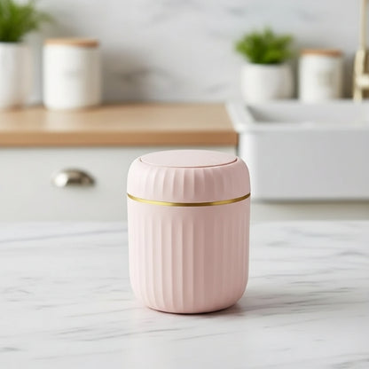 poubelle de table rose design cerclage doré chic sur comptoir