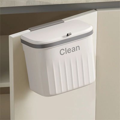 porte armoire ouverte avec poubelle sous évier